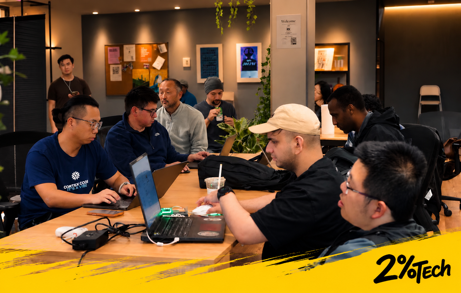 Builders working on laptops together